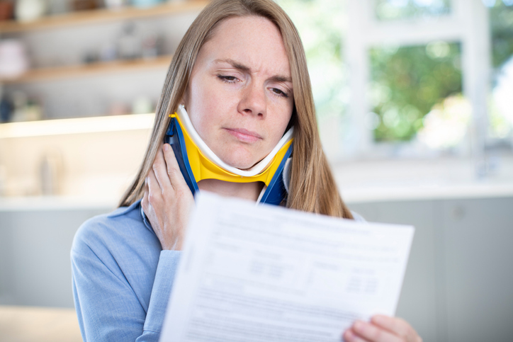 Neck and Back Injuries - woman reading letter
